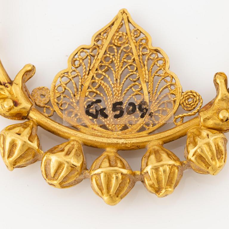 A pair of presumably modern Eastern Mediterranean gold earrings.