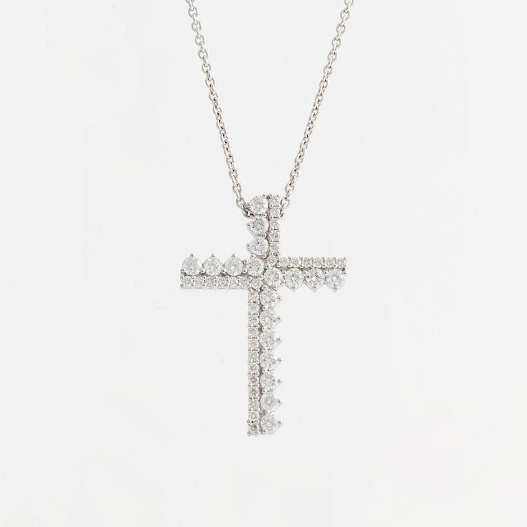 Brilliant cut diamond cross necklace.