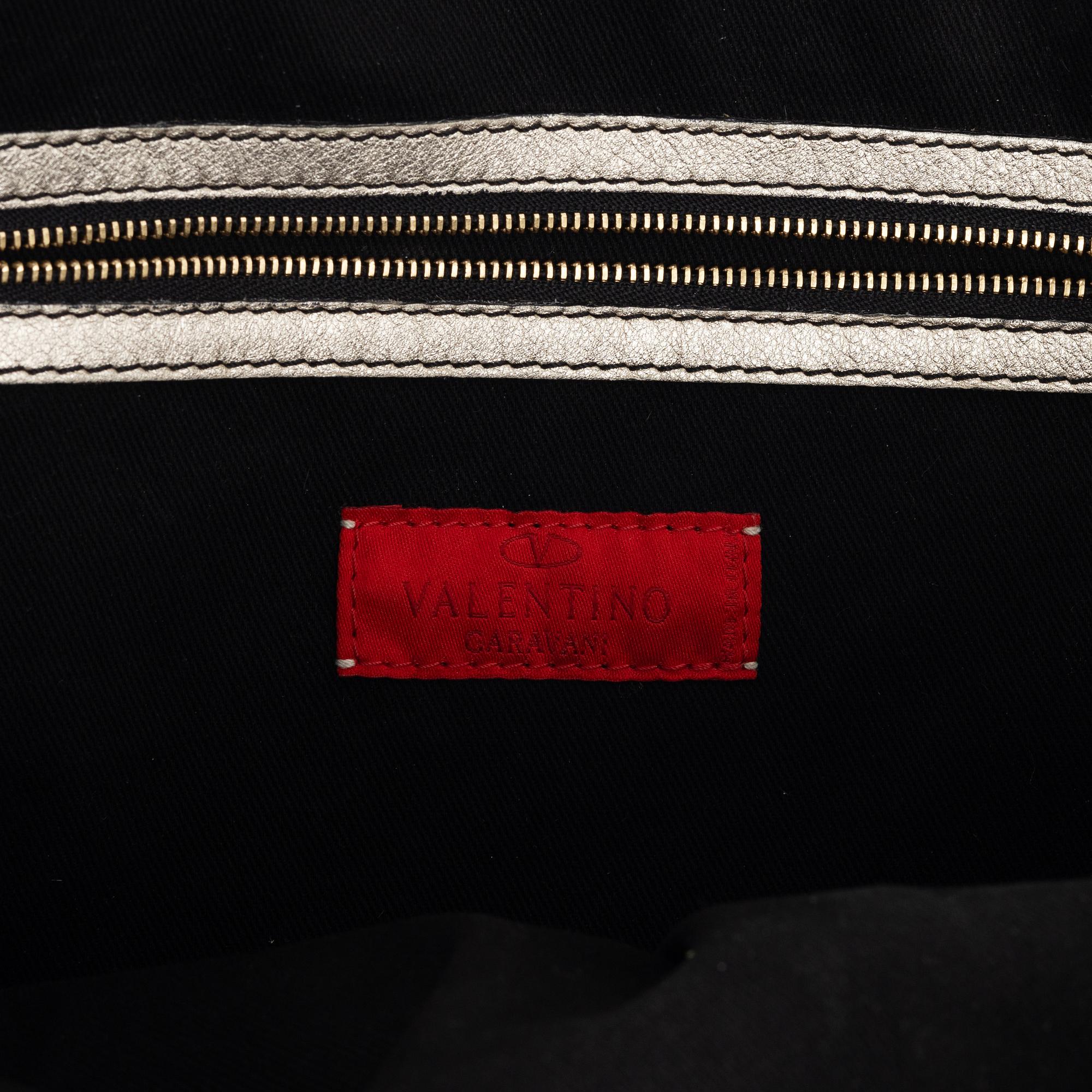 Valentino Garavani, A metallic leather bag.