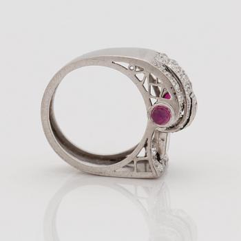 An odeonesque cabochon cut ruby, old- and step- cut diamond ring. Circa 1940's.