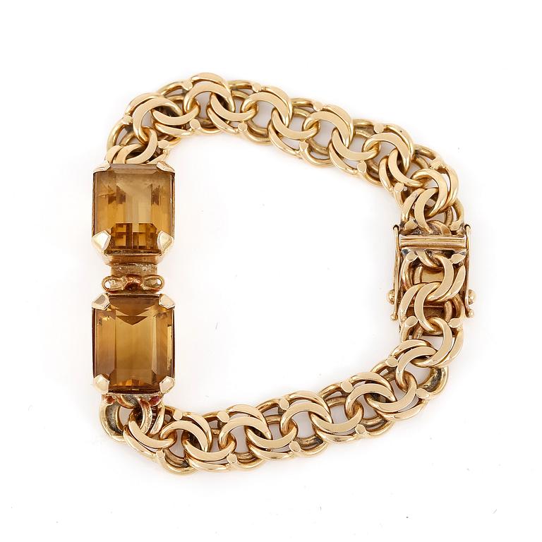 ARMBAND, 18K guld med fasettslipade citriner, NSE, Köping, 1970. Vikt 26,0 gram.