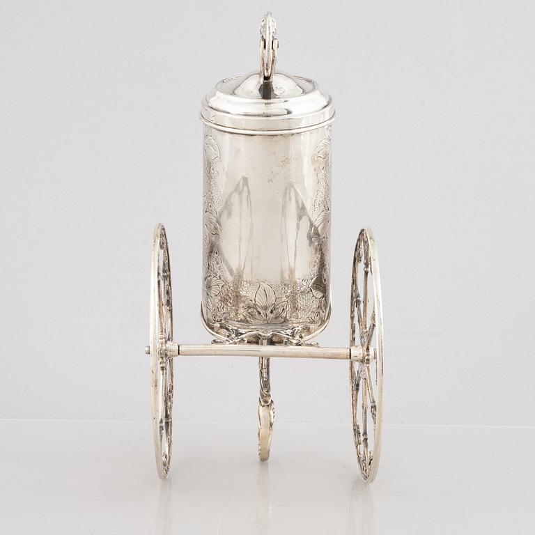 A silver bottle holder with wheels, 20th Century.