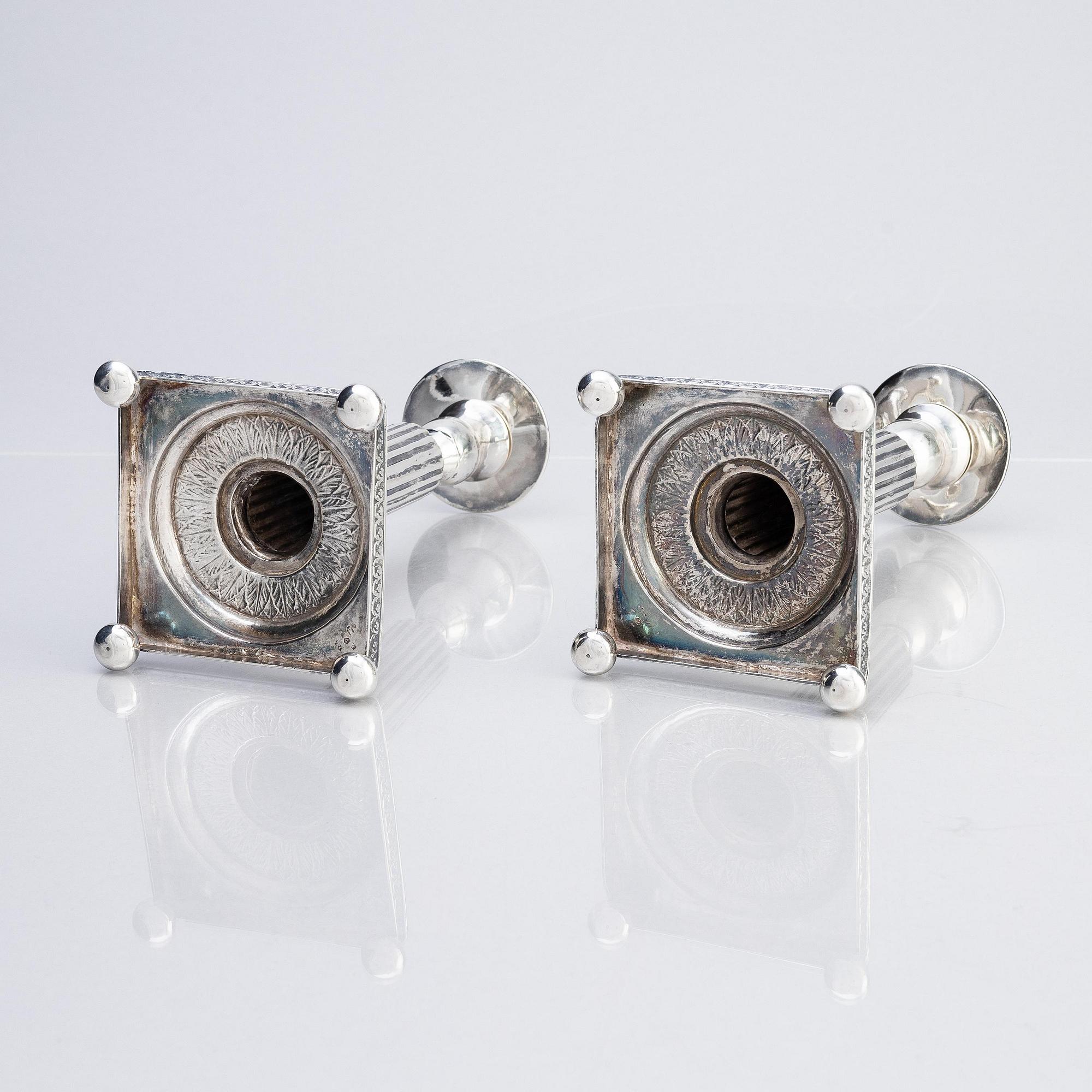 A pair of Gustavian silver candlesticks, unclear maker's mark, the cuffs with mark of Pehr Zethelius, Stockholm 1796.