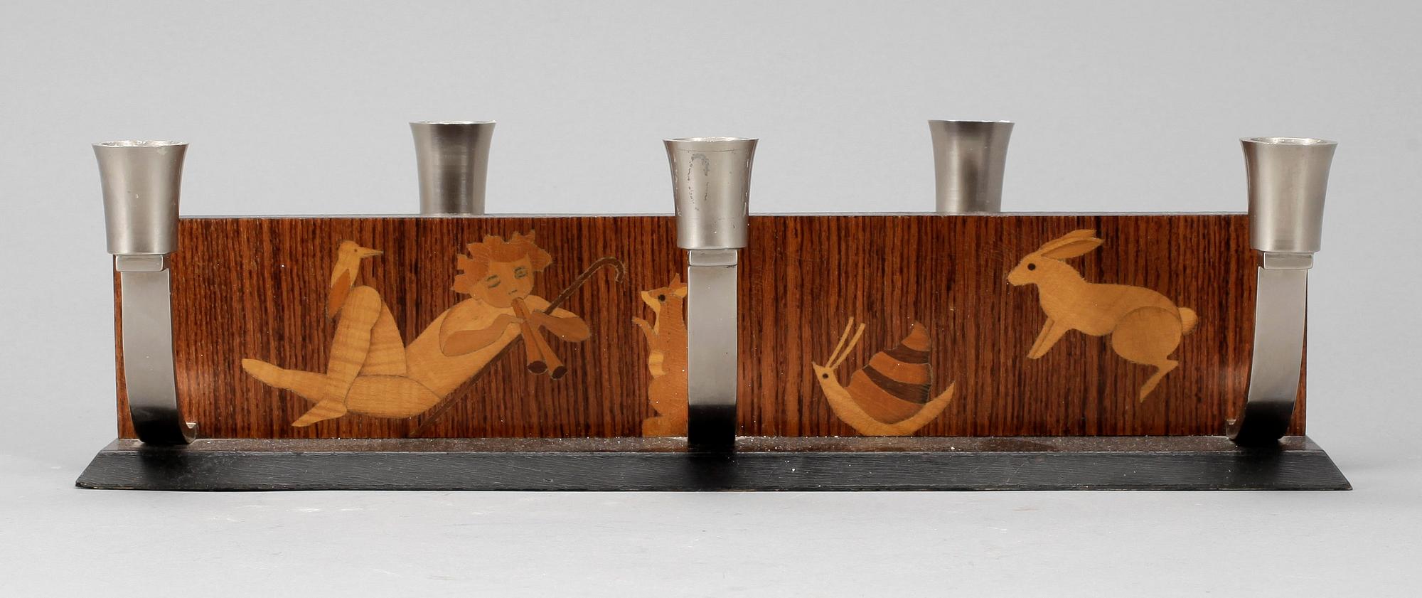 LJUSSTAKE, Mjölby Intarsia, 1900-talets första hälft.