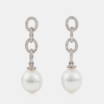 1324. A pair of oval cultured South sea pearl and brilliant-cut diamond earrings. Pearls 12.5 - 15 mm.