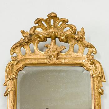 A Rococo giltwood mirror by Nils Meunier (master in Stockholm 1754-97, royal court mirror maker 1769).