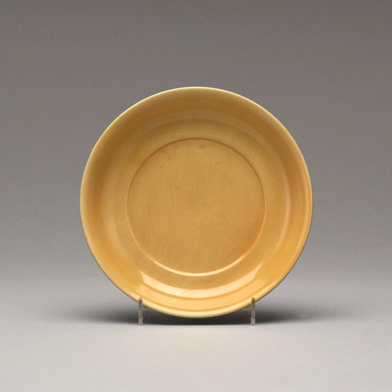 A yellow glazed dish, Ming dynasty, Xuande mark and of the period (1425-35).