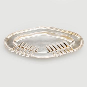 Serving platter, silver, Czechoslovakia, and twelve serving utensils, Alexander Sturm, Austria-Hungary, 1867-1941.