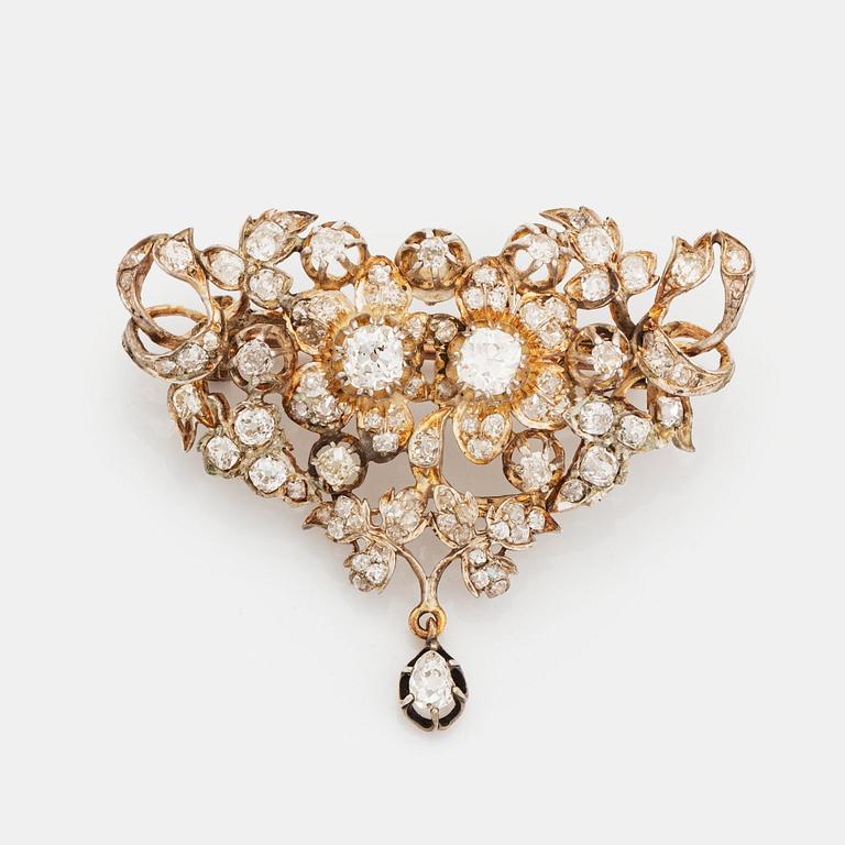 A silver brooch set with old-cut diamonds.