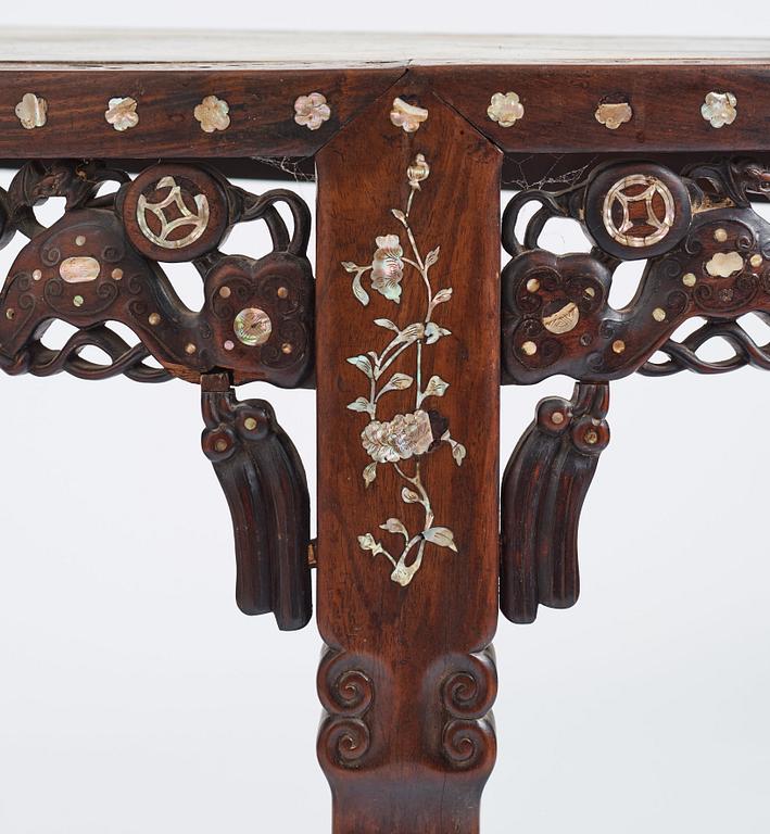 A Chinese hardwood demi-lune side table with mother-of-pearl inlays, late Qing dynasty.