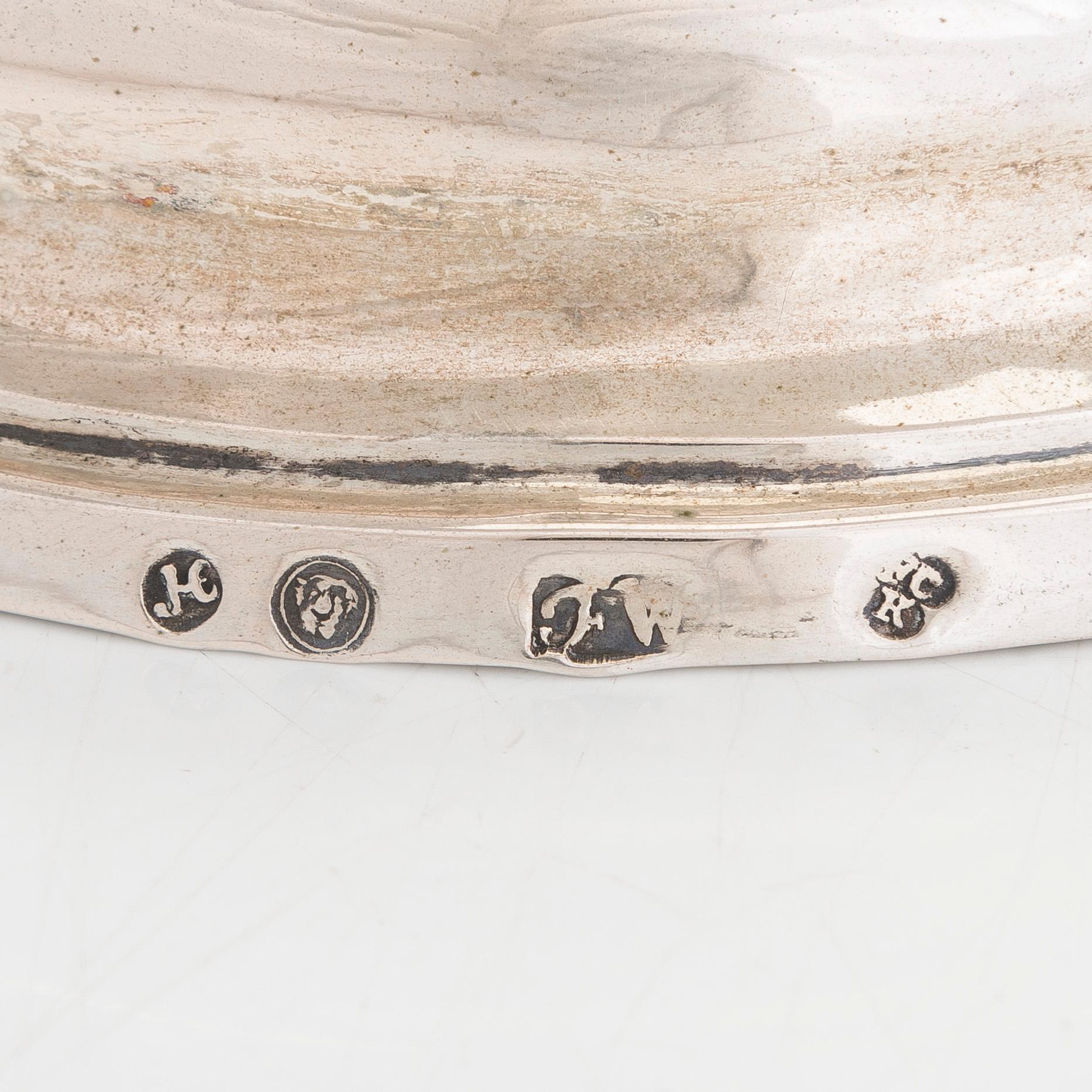 A pair of silver candelabra by Ferdinand Christian Krebs, Breslau, 1776-1792, with snuffers from Reval. Neo-classicism.