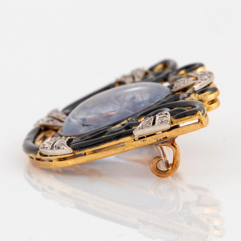 An 18K gold and platinum brooch set with a sapphire and rose-cut diamonds.