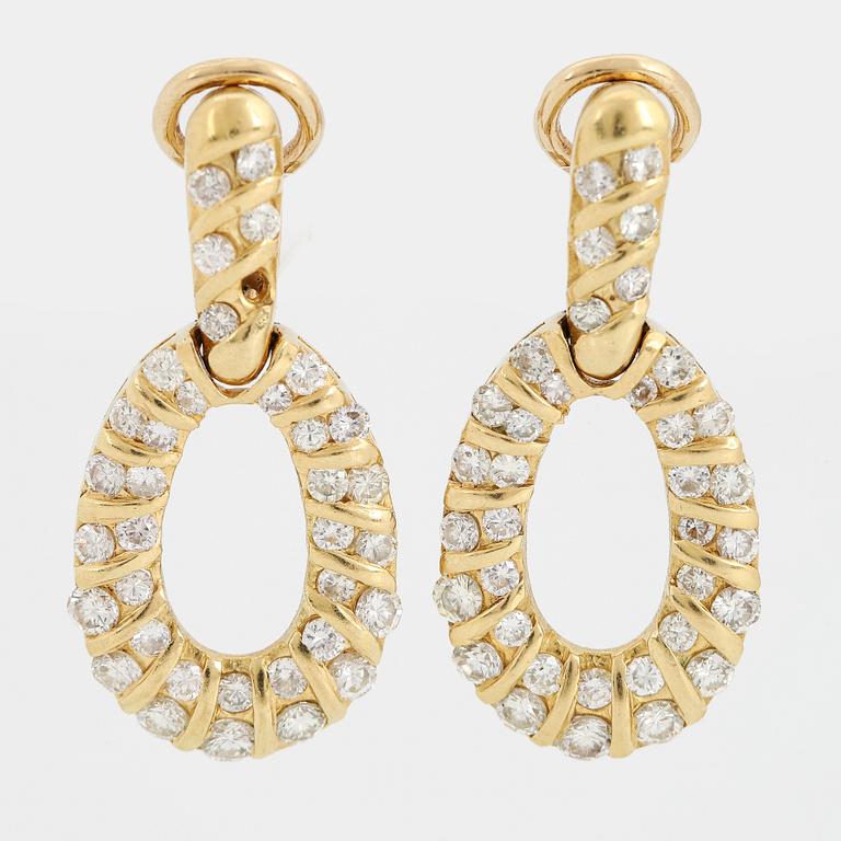 Brilliant-cut diamond earrings.