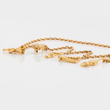 An 18K gold  Dior necklace with charms.