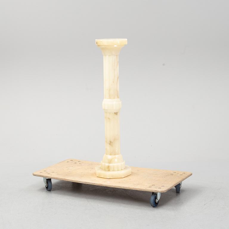 A 20th century alabaster pedestal.