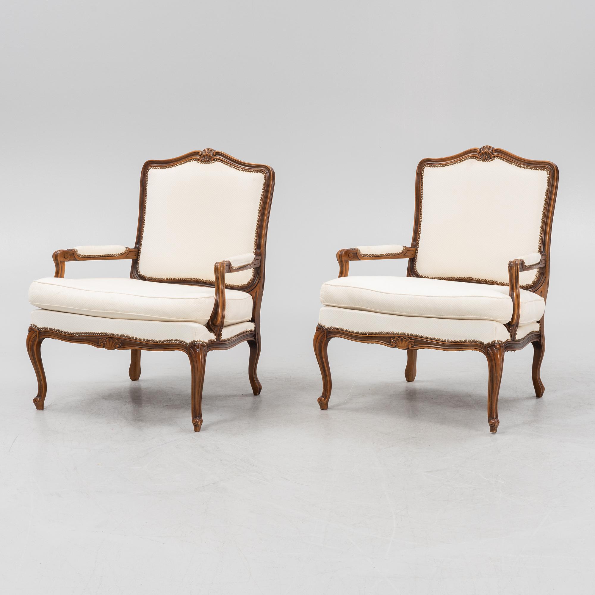 A pair of Rococo style armchairs, later part of the 20th century.