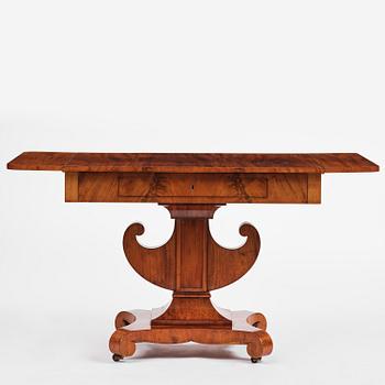 A Swedish Empire mahogany center table.