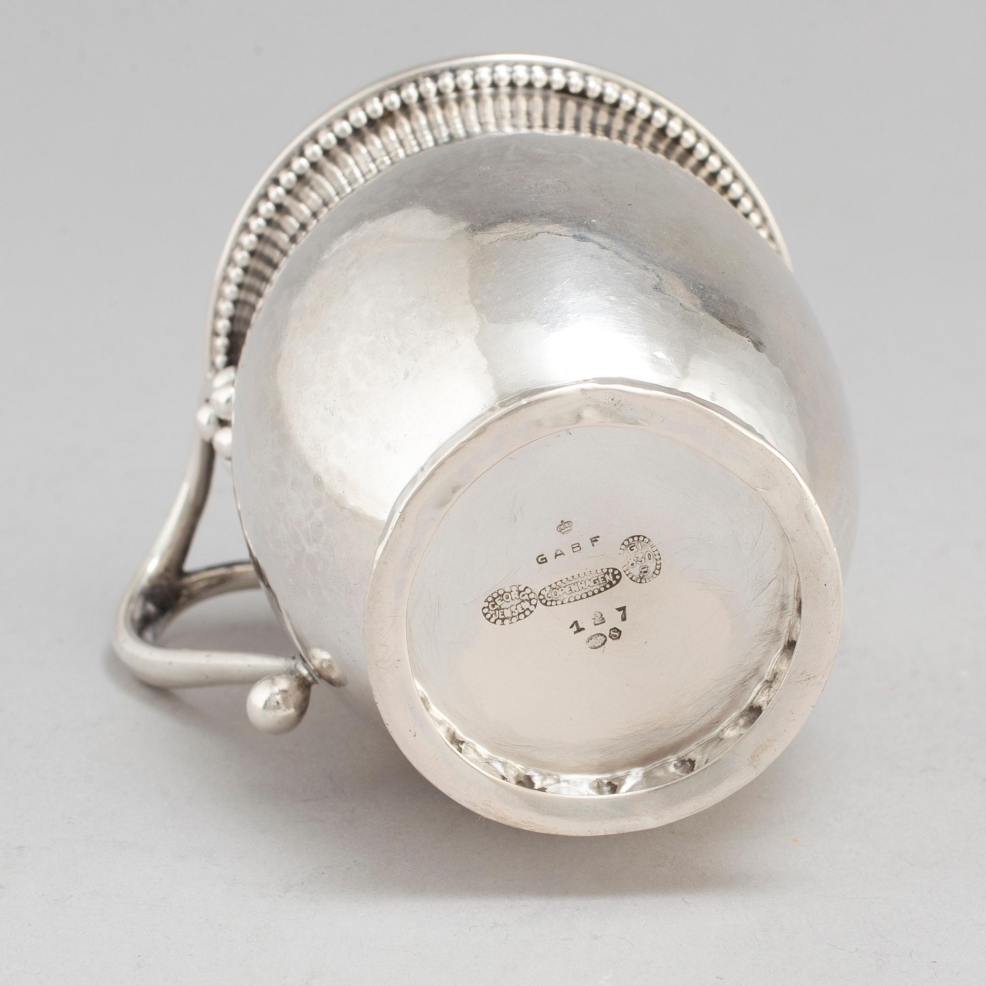GEORG JENSEN,  a 830/1000 silver mug and  a bowl (a christening set), Copenhagen ca 1918-1927, design nr 127, 158.
