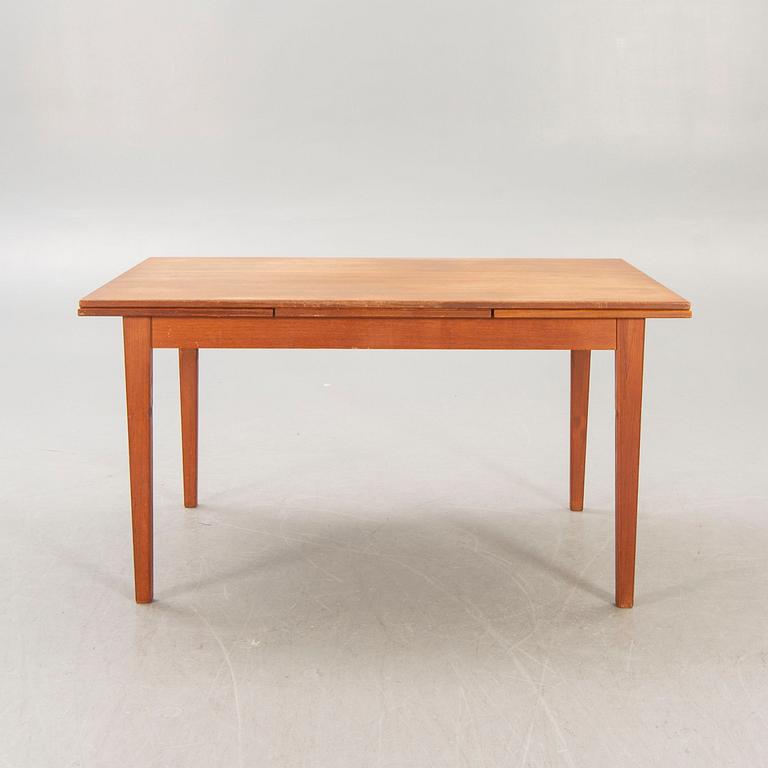 A Danish 1960s teak dining table.