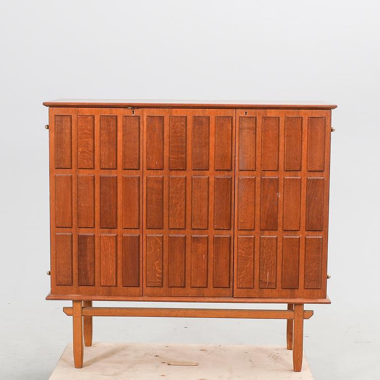 An Eyvind Beckman  a 1940s oak cabinet.