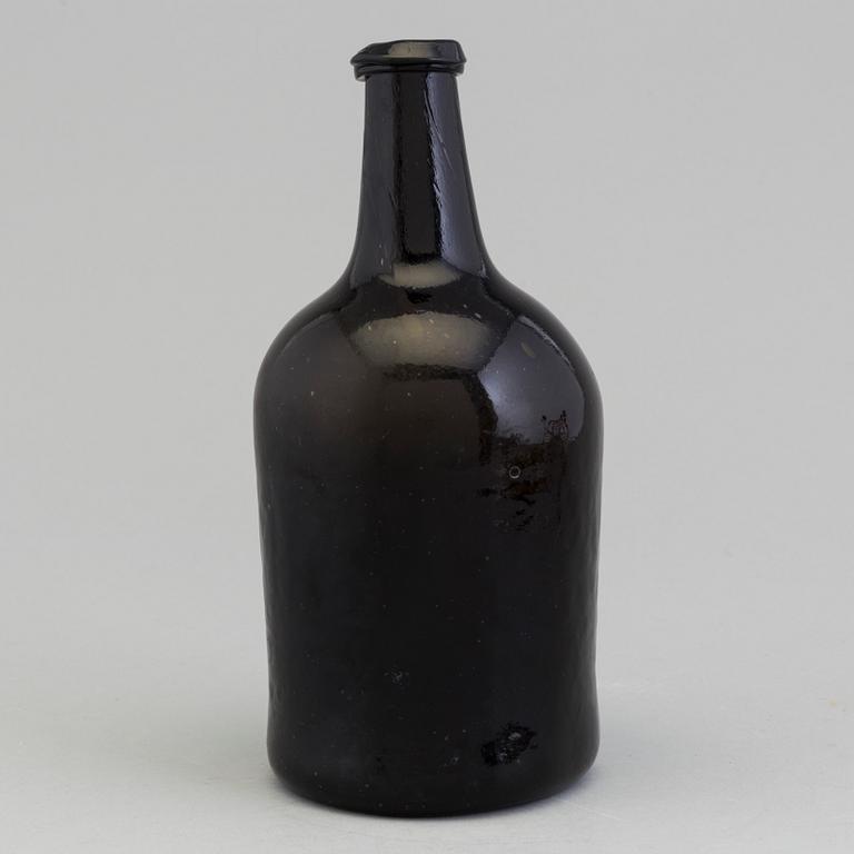 An 18th Century glass bottle.