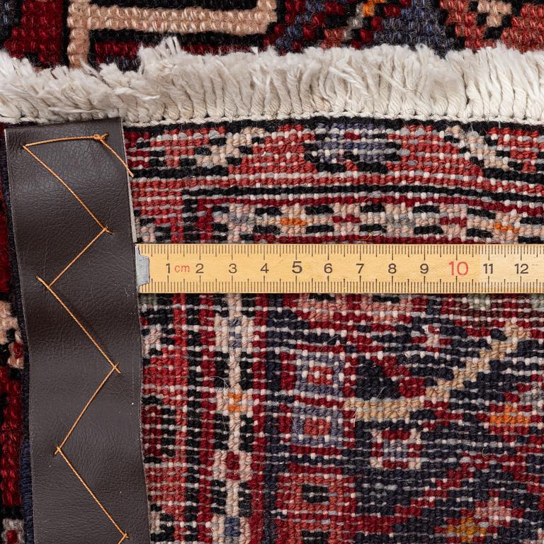 A semi-antique Karadja runner, c. 405 x 155 cm.