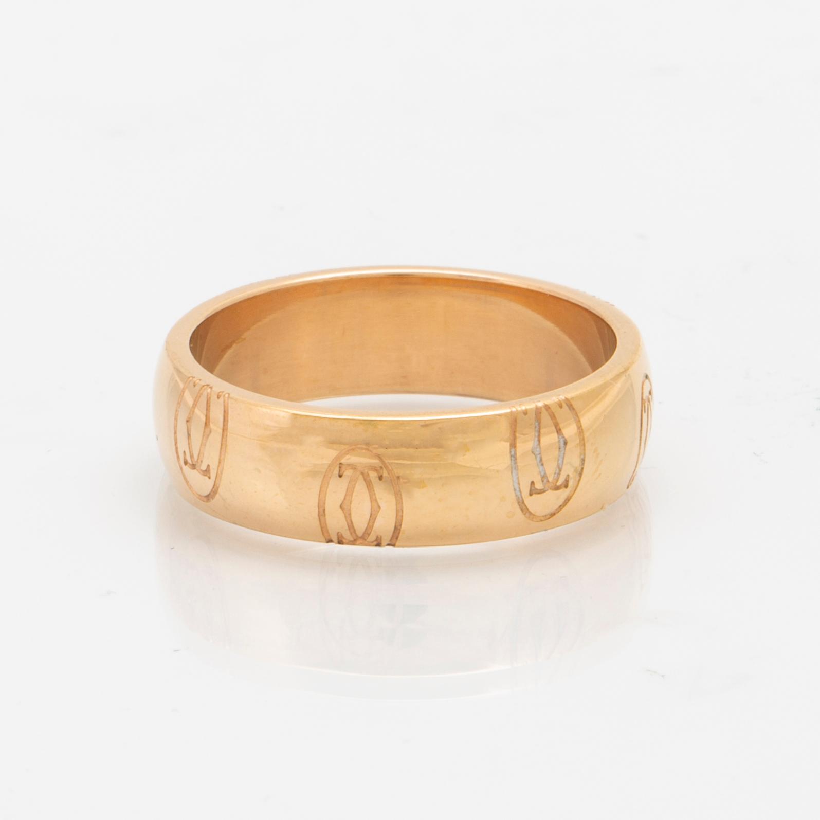 An 18K gold ring "Logo de Cartier" by Cartier.