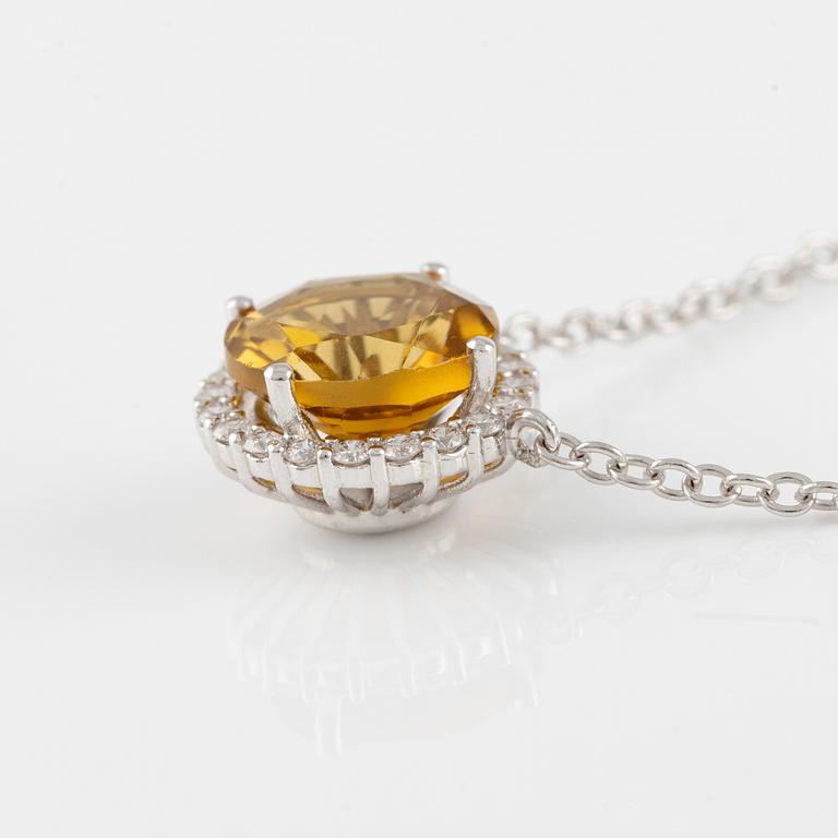 Necklace in 18K gold with a faceted tourmaline and round brilliant-cut diamonds.