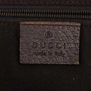 Gucci, a canvas and leather bag.