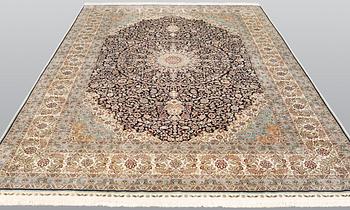 An oriental silk carpet, c. 297 x 202 cm.