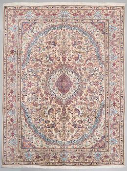 A Nain rug, part silk, 390 x 287 cm.