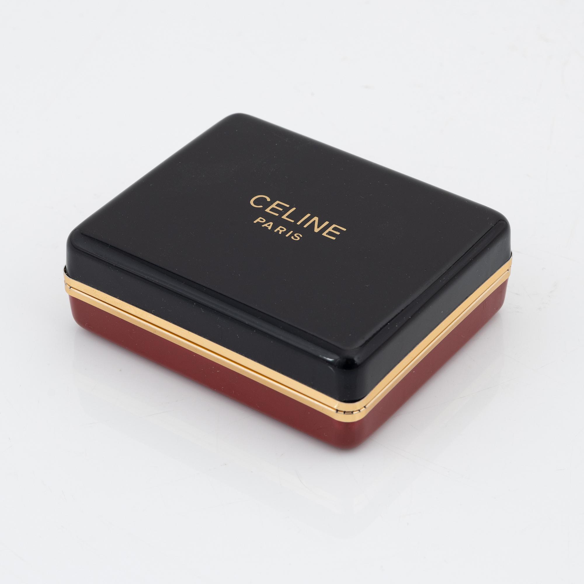 Céline, a pair of gold tone and rhinestone clip-on earrings.