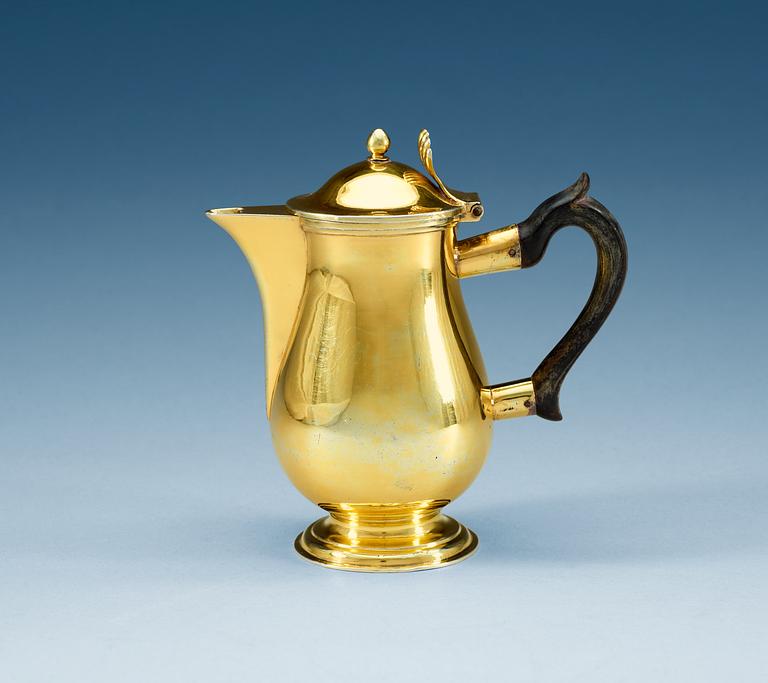 A Russian 19th century silver-gilt coffee-pot, makers mark of Alexander Jaschinkov, St. Petersburg 1805.