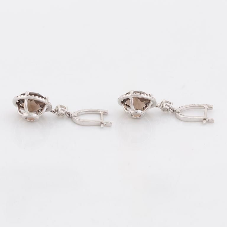 Smoky quartz and brilliant cut diamond earrings.