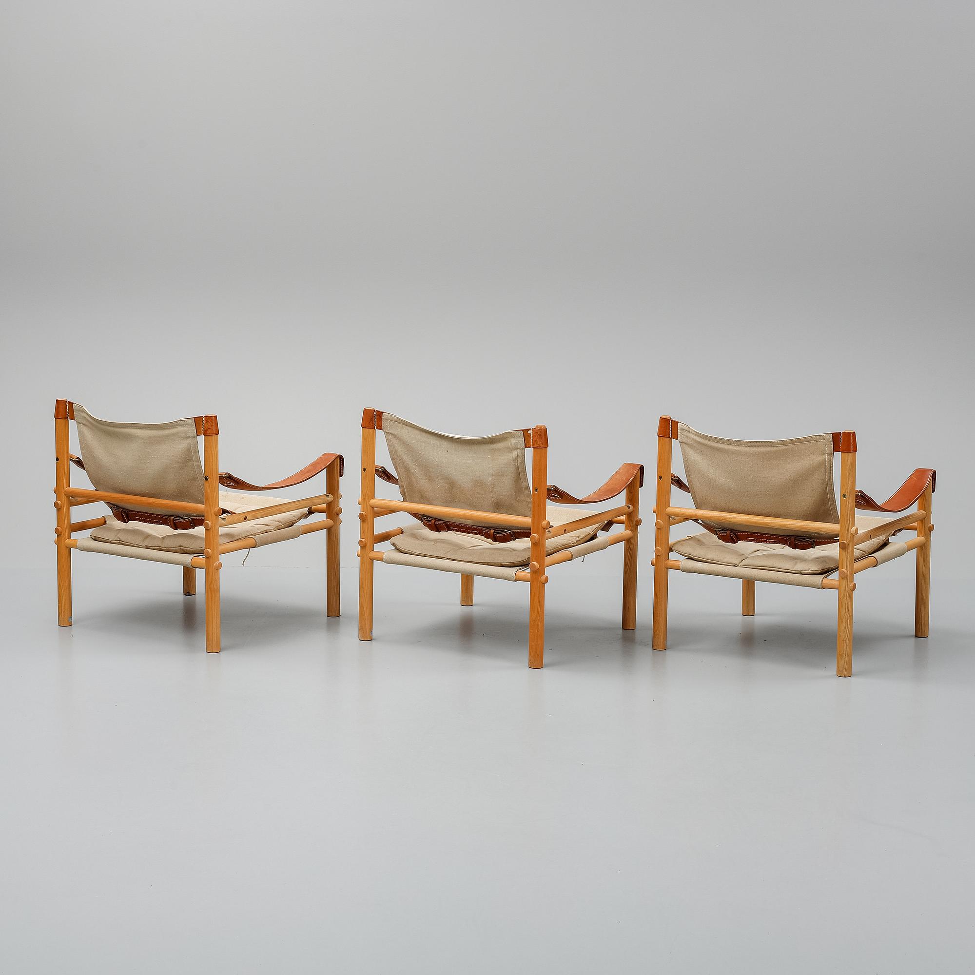 Arne Norell, a set of three "Sirocco" armchairs and two tables, Norell.