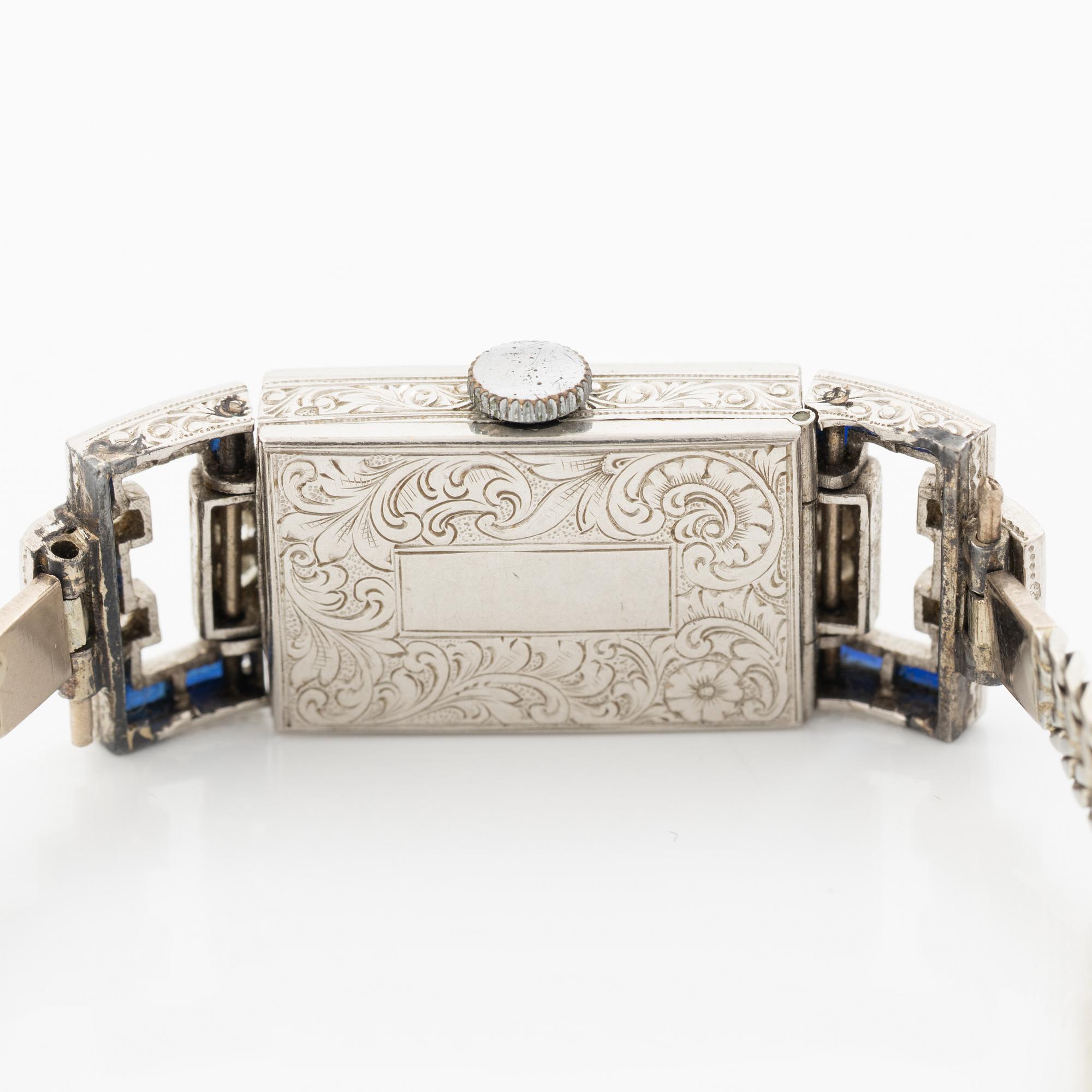 Ladies’ wristwatch in platinum and 18K white gold with old-cut diamonds and sapphires, Art Deco.