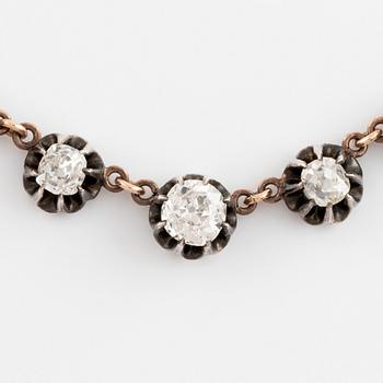 A gold and silver necklace set with old- and rose-cut diamonds.