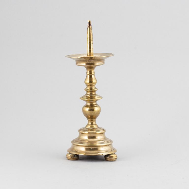 A 16th century bronze candlestick.