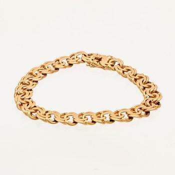 An 18K gold Bismarck bracelet.