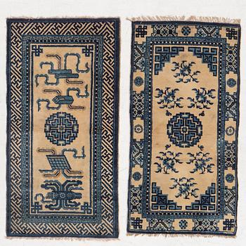 Two antique Chinese Pao-Tow rugs, c. 125 x 65 and 125 x 60 cm.
