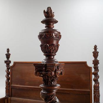 A carved Baroque style bed, early 20th Century.