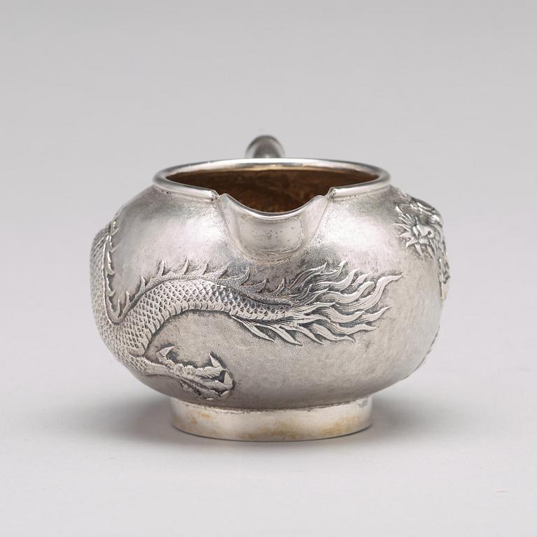 A Chinese four piece silver tea set, Luen Wo, Shanghai, 1875-1925.