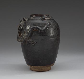 A black and brown glazed jar with a dragon in relief, Song dynasty (960-1279).