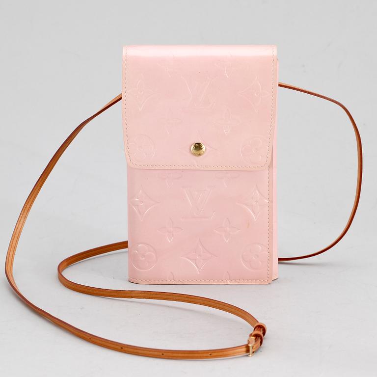 A pink monogram vernis purse by Louis Vuitton.