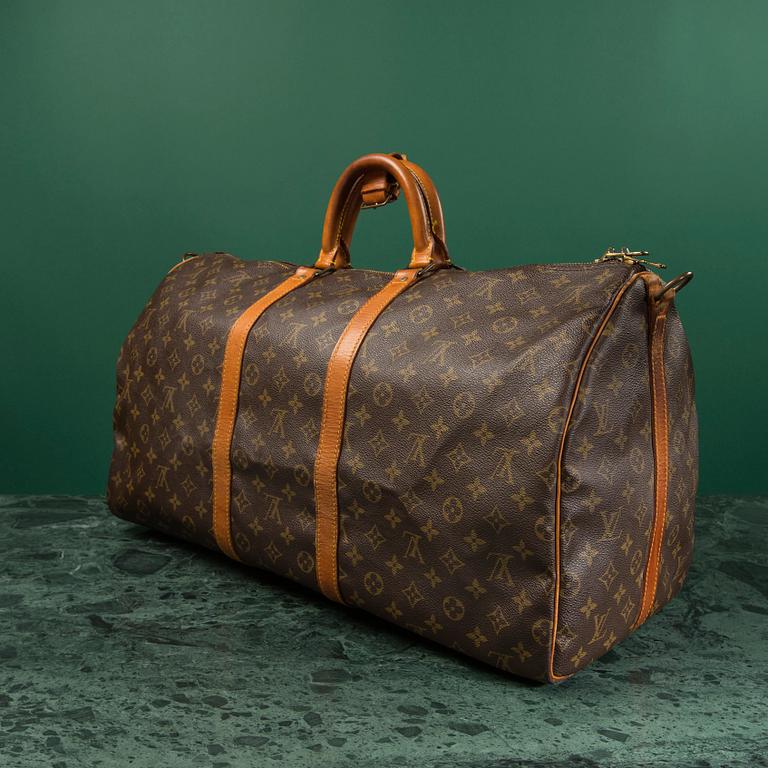 A monogram canvas weekendbag "Keepall 55 Bandoulière " by Louis Vuitton.