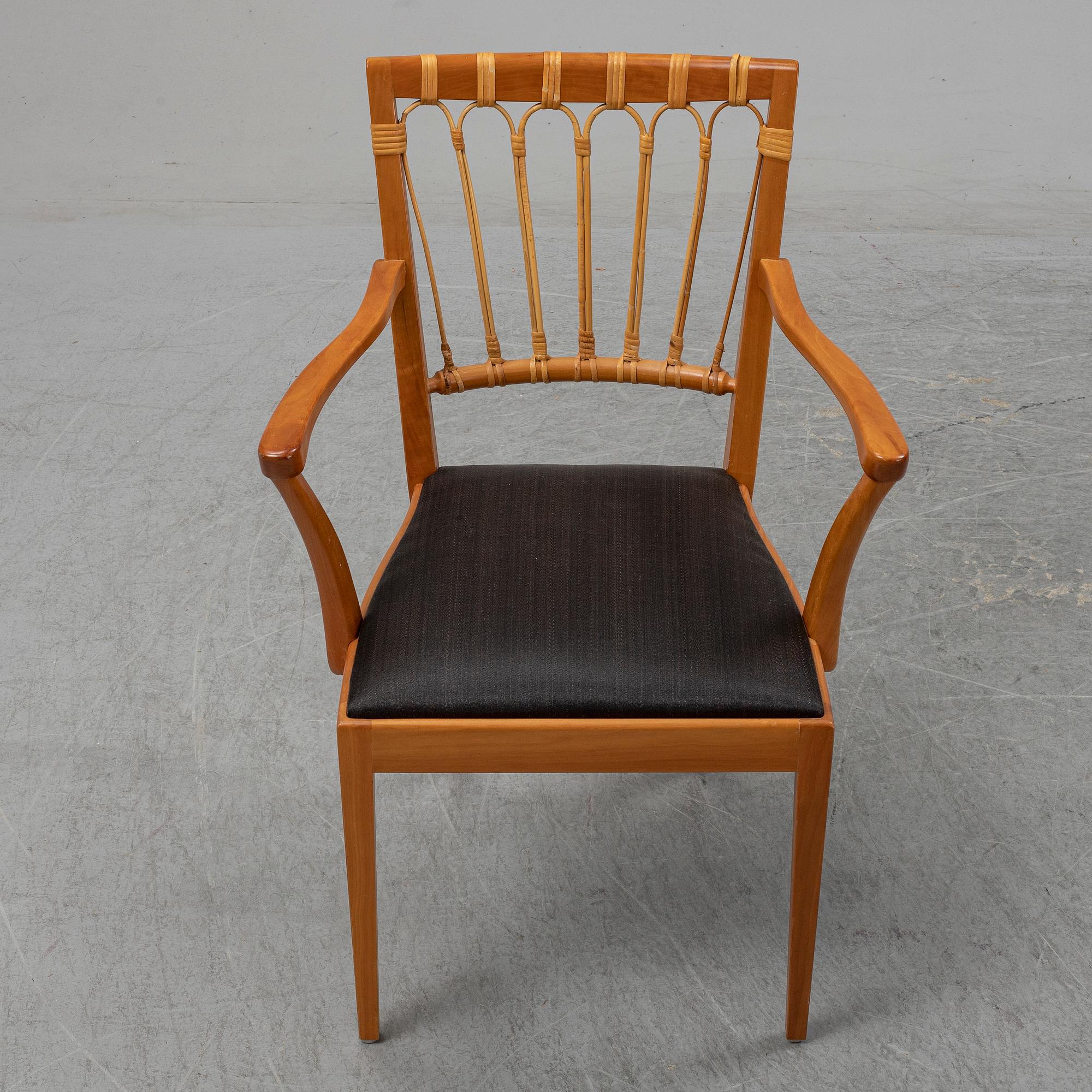 A pair of mahogany and rattan dining armchairs, Josef Frank, , model 1165, Svenskt Tenn, Stockholm.