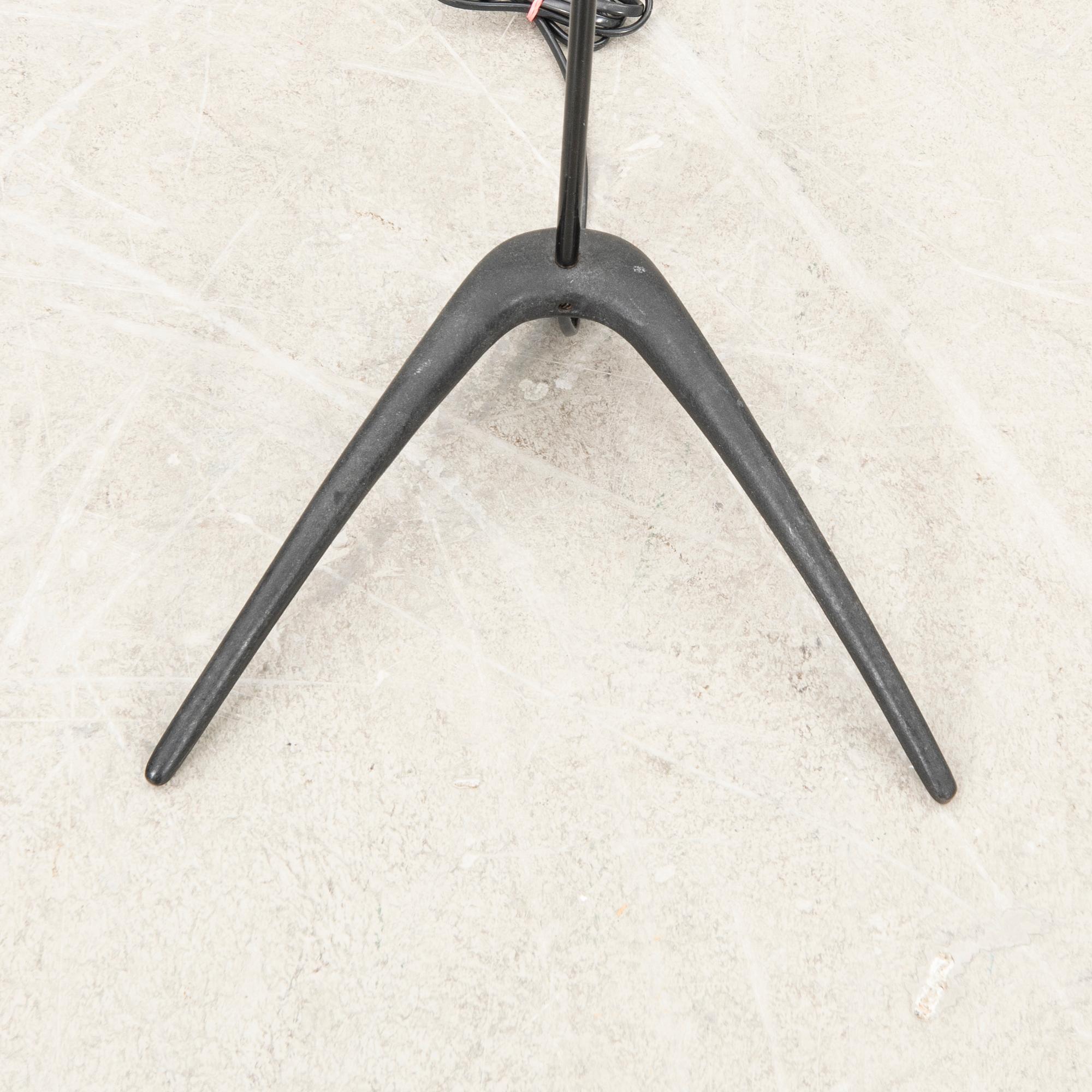 A metal floor lamp from the later part of the 20th century.