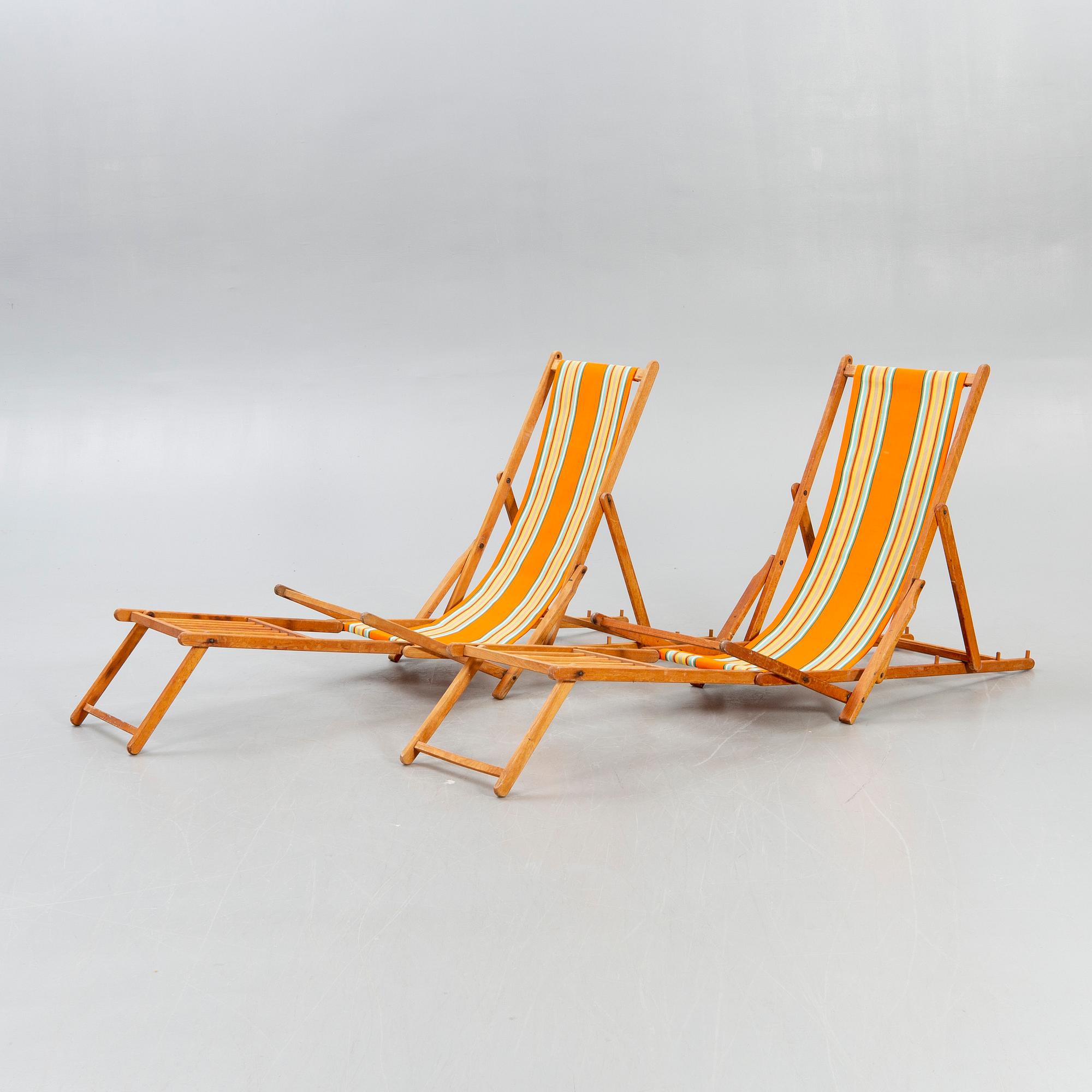 Sun loungers, a pair of footstools, 1950s.