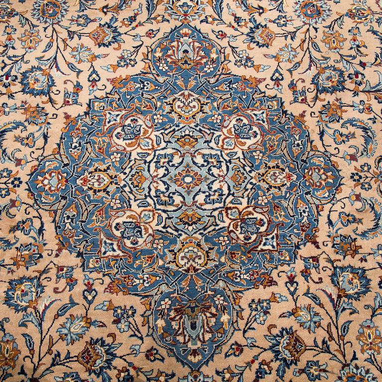 A carpet from Mashad, around 381 x 297 cm.
