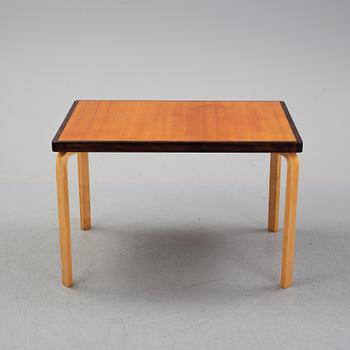Alvar Aalto, a teak dining table, Artek, Finland, mid 20th Century.